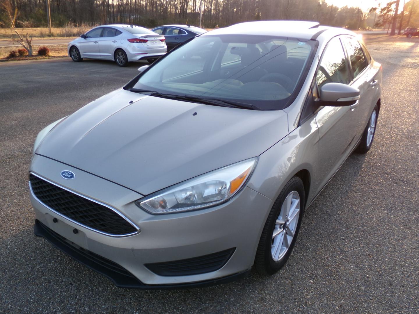 2015 Tectonic Silver Metallic /Black Ford Focus (1FADP3F23FL) , located at 401 First NE, Bearden, AR, 71720, (870) 687-3414, 33.726528, -92.611519 - Photo#0